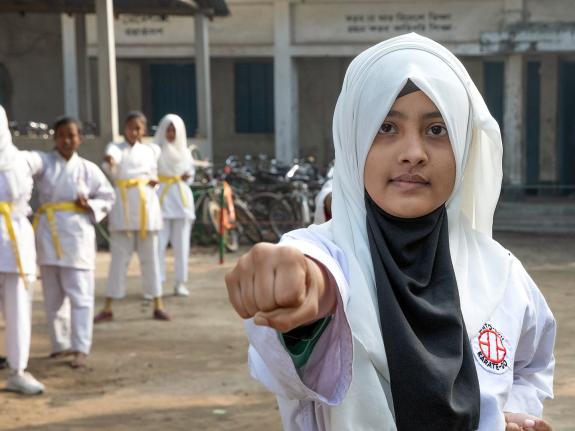 Rinky, 12, practicing karate at her school in Bangladesh