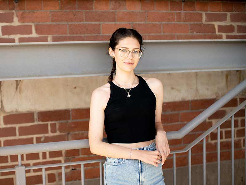 A girl smiles at the camera