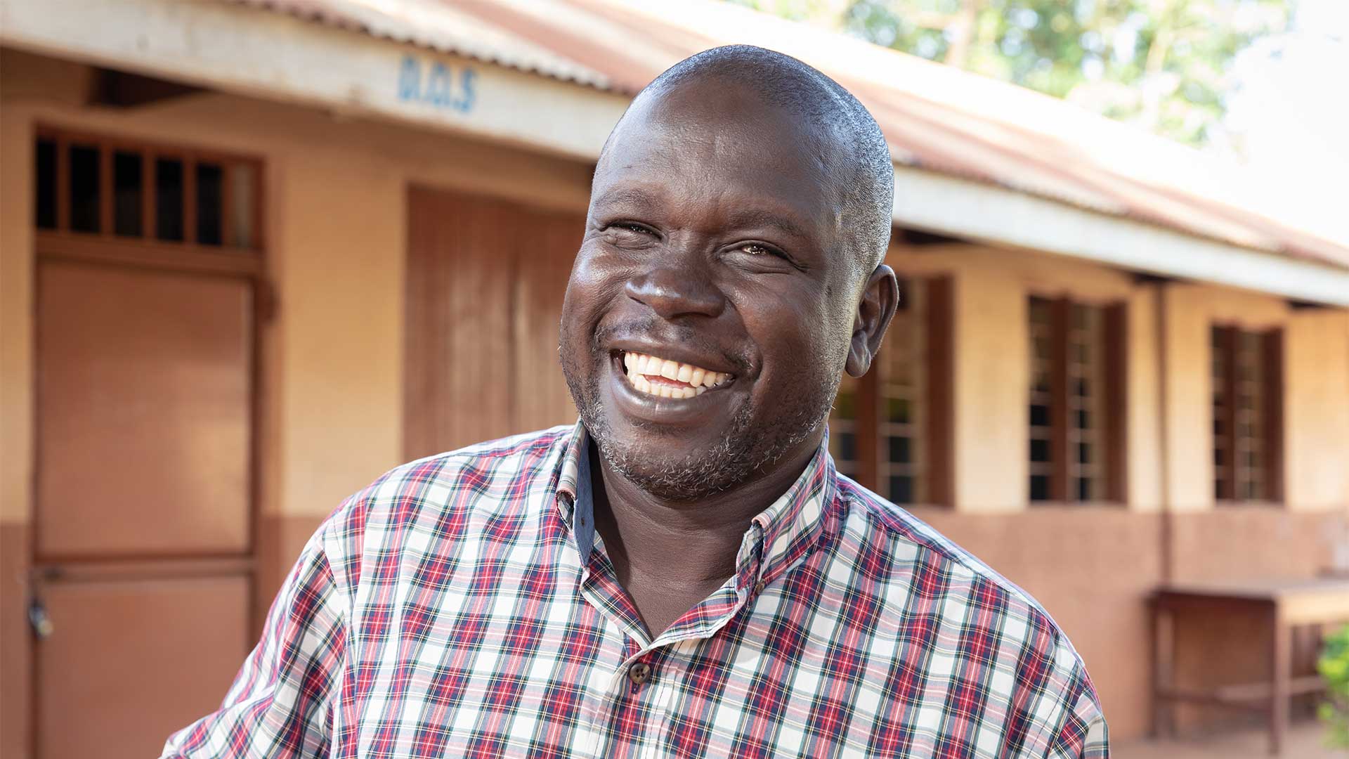 Parent volunteer smiling at camera