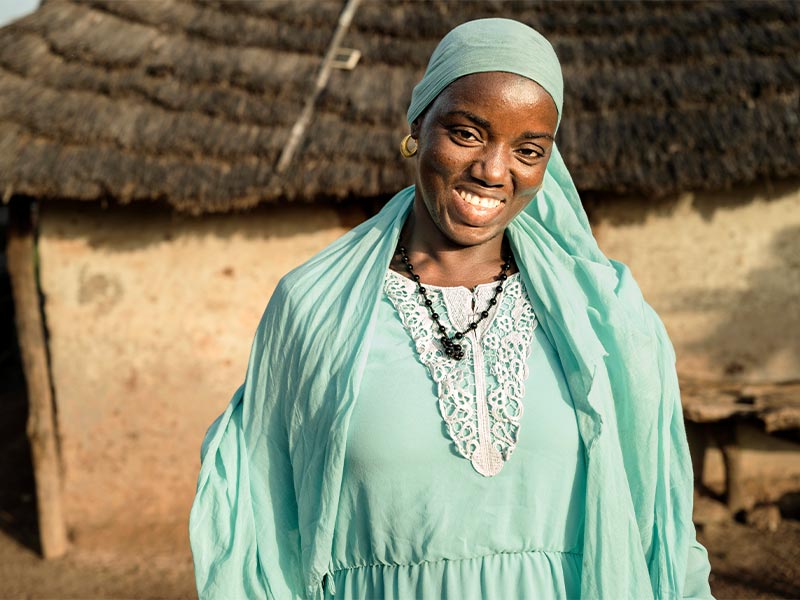 Soumtou standing outside smiling at camera