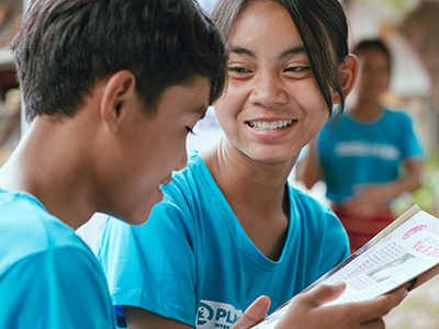 Two children in Vietnam participate in the Champions of Change club. 