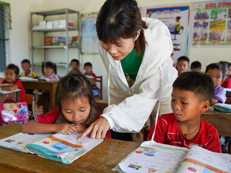 Children in Vietnam are taught in a classroom.