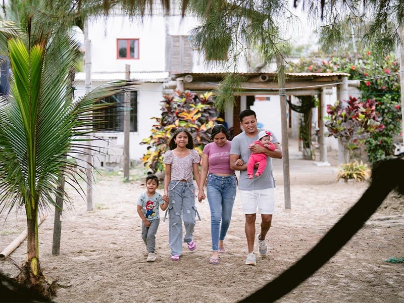 Kevin walking outside with his family