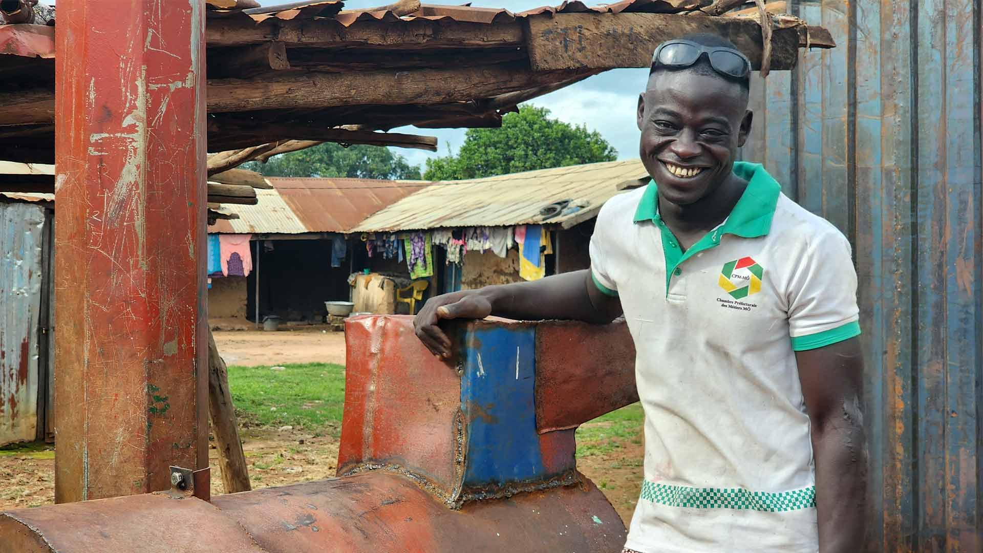 Kakarika smiling at camera with arms crossed