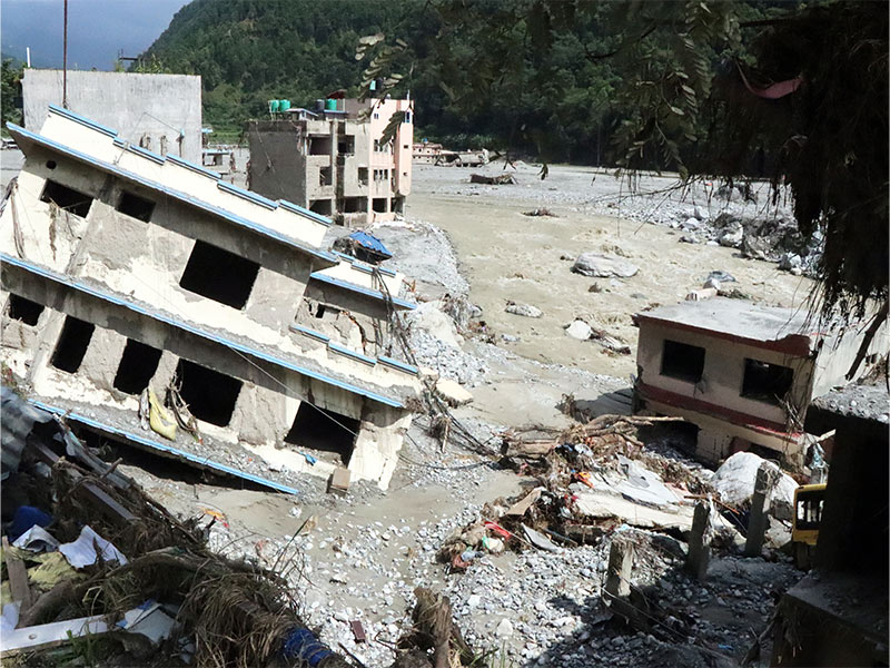 Buildings buried in mud along the Trishuli river