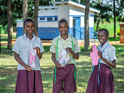 Students with some of the reusable sanitary pads they have made 