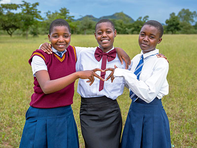 Evelyn, 16, with two of her friends from the dormitory