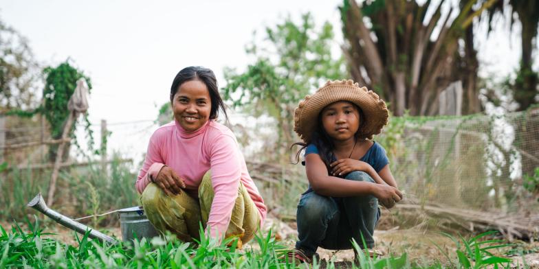 Len Sokha, 10, picking vegetables with her mother in Cambodia