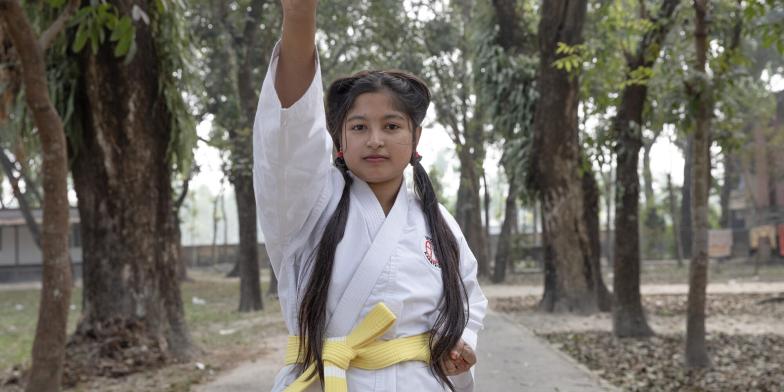 Akhimoni, 15, practicing karate in Bangladesh