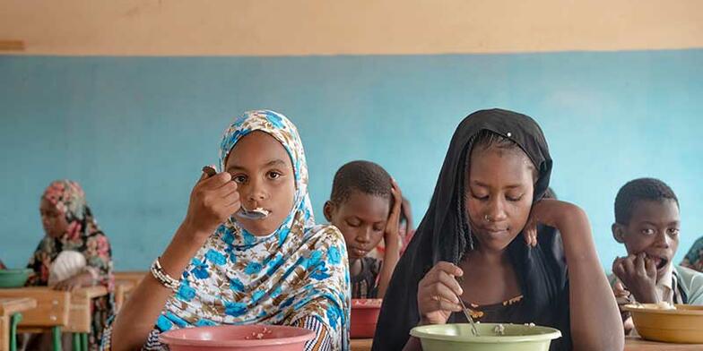 Girls eat at school