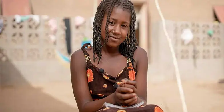Girl smiles at the camera
