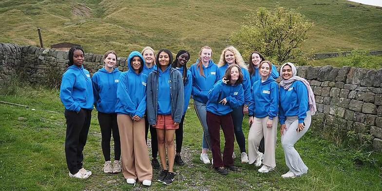 Plan UK Youth Advisory Panel members standing in a group