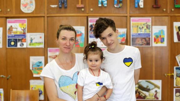 Viktoriia with her two children, Nikita, 14, and Leva, 2 in Bucharest, Romania.