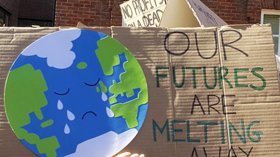 Our futures are melting away placard at climate strike action in UK