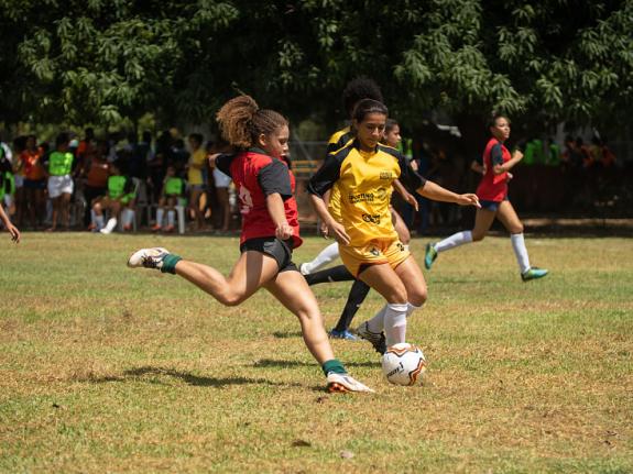 Girls playing in a football tournament as part of a Plan International programme in Brazil