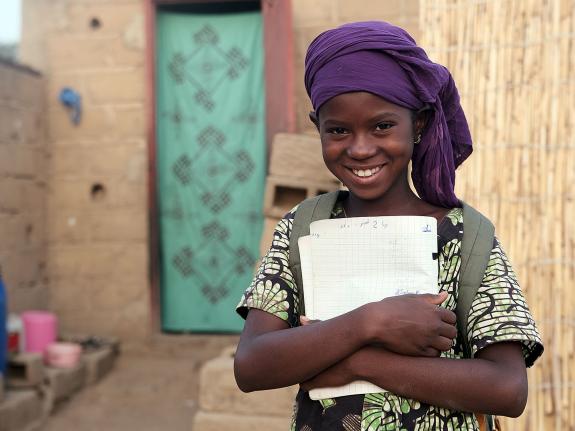 Salimata, 12, is studying hard at school in Mali to achieve her dream of becoming a dressmaker. 
