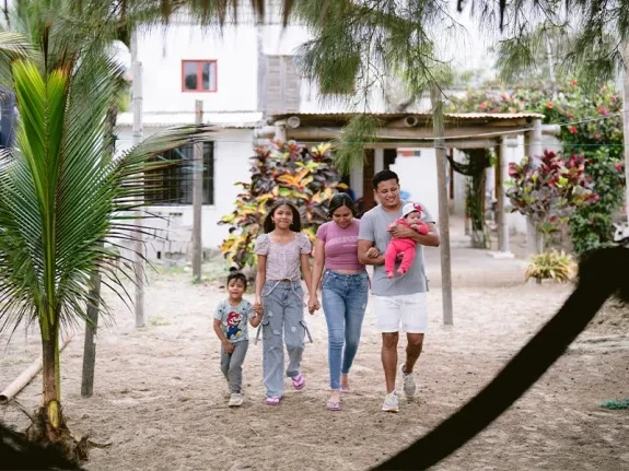 Kevin walking outside with his family