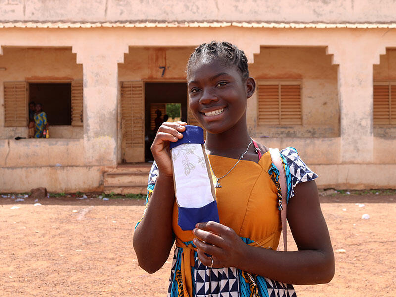 Kologo with one of the sanitary pads she made during the training workshop 