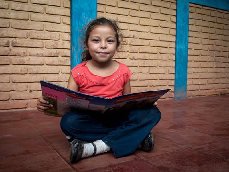 A girl reads a book in Nicaragua