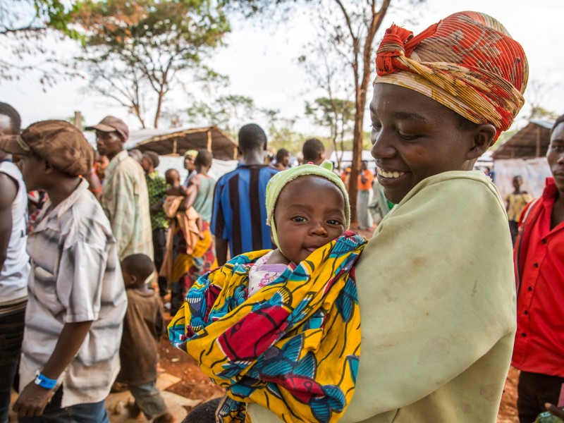 Burundi refugee mum holds her baby