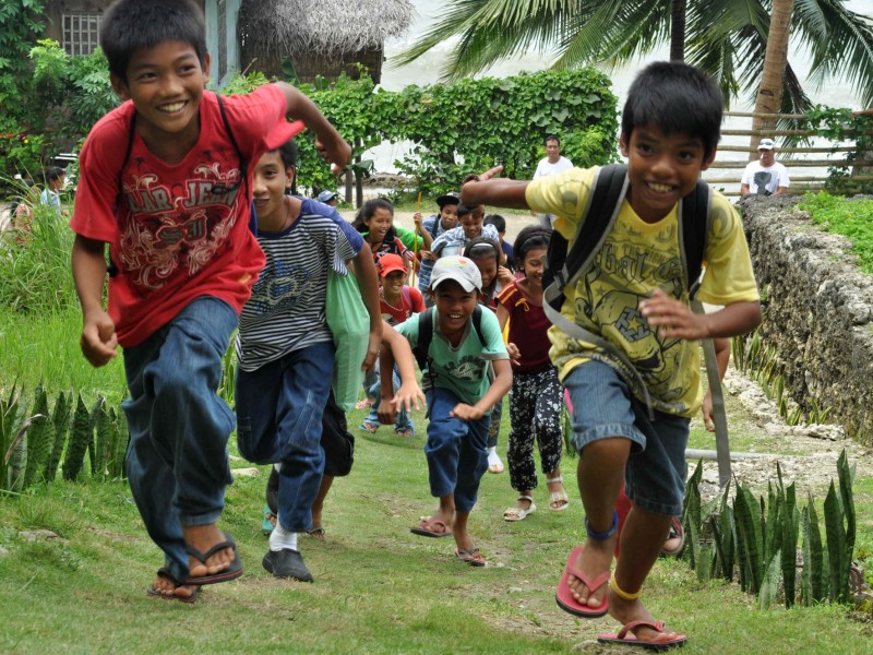 Children practice evacuating a school during a disaster drill