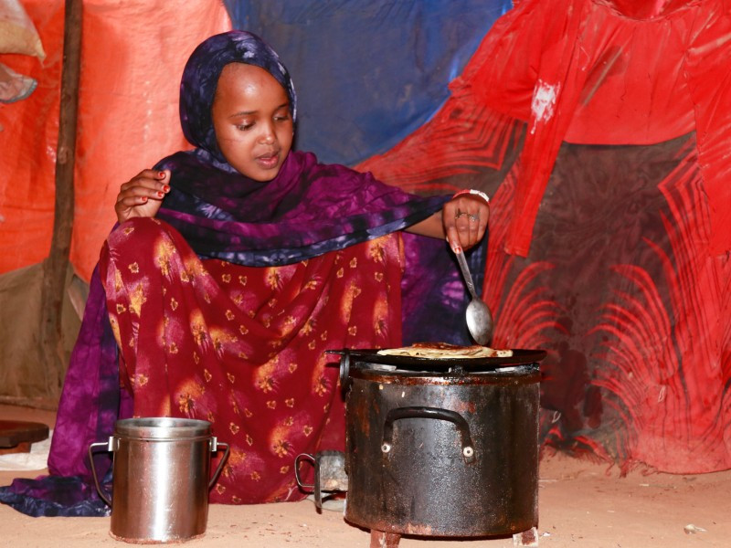Najma cooking food for her family