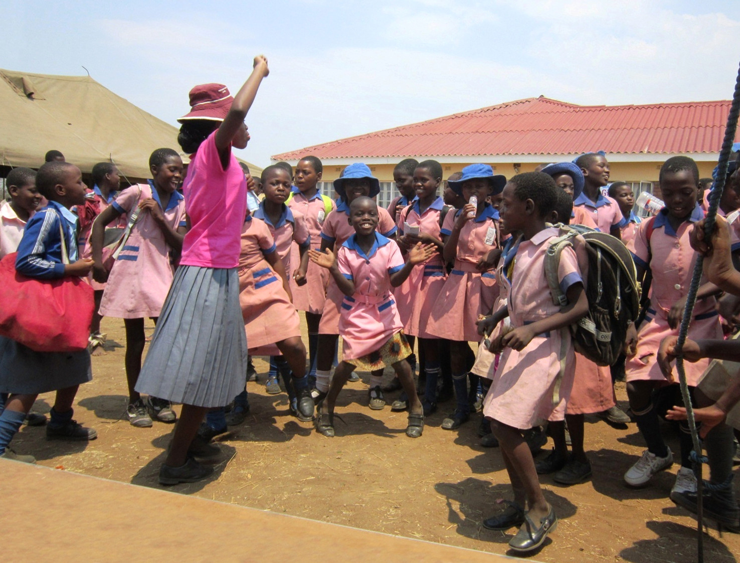 Girls from a school in Zimbabwe celebrate