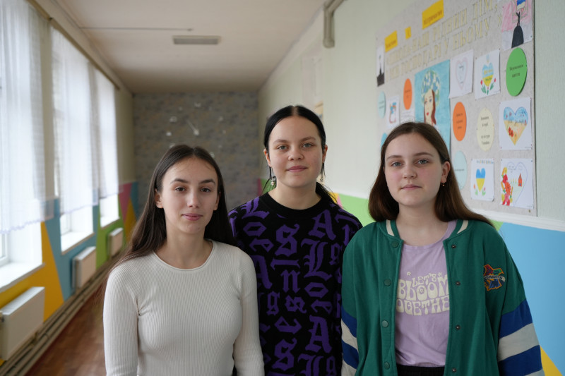 Friends Zenhya, 17, Amina, 14, and Nastya, 15, return to a safe and refurbished school