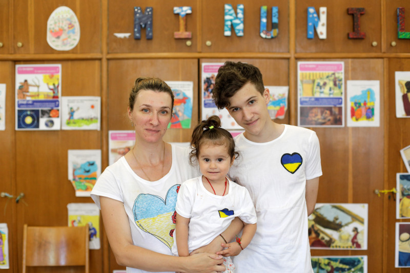 Viktoriia with her two children, Nikita, 14, and Leva, 2 in Bucharest, Romania.