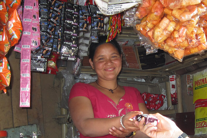 A woman selling goods from her shop