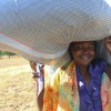 A Nigerian woman recieves aid from Plan International UK