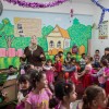Syrian mums play with children in Plan's parenting education sessions
