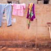 Clothes drying on the wall of the wash block in Nyarugusu camp