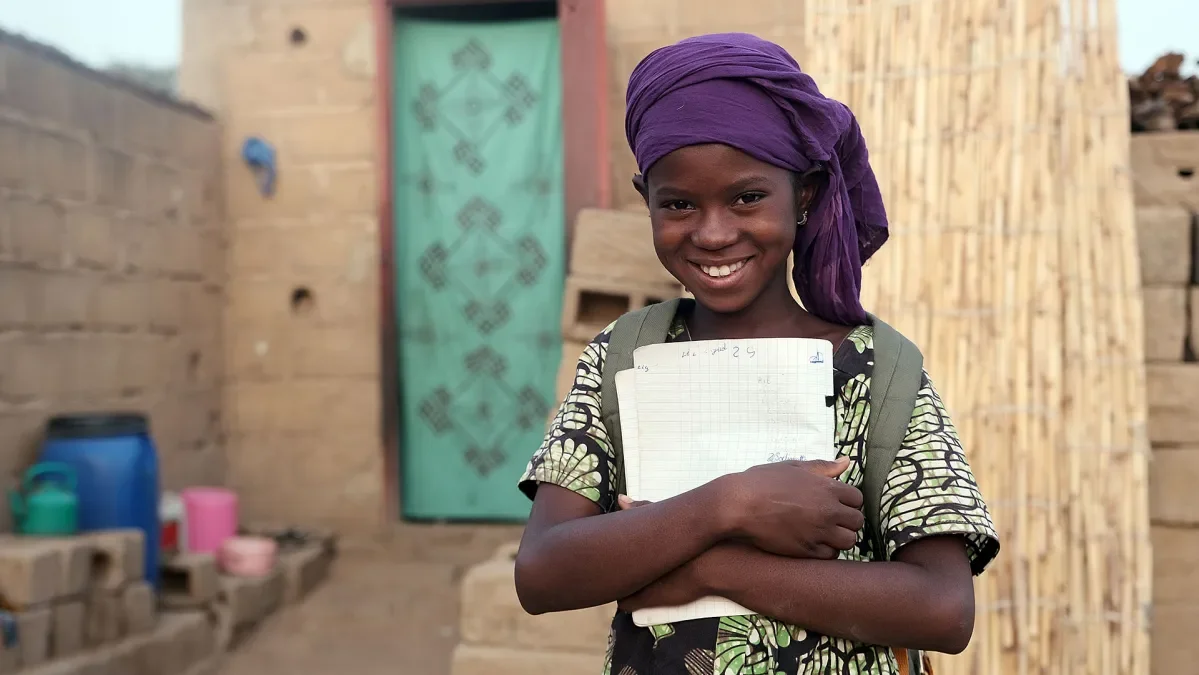 Salimata, 12, is studying hard at school in Mali to achieve her dream of becoming a dressmaker. 
