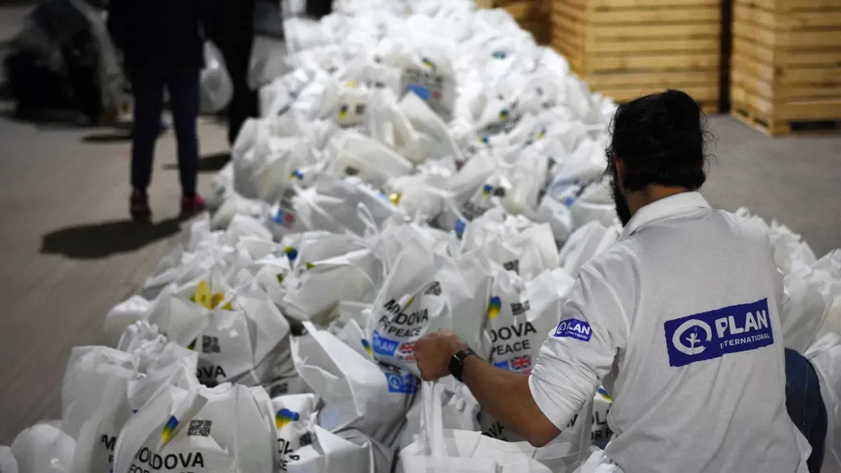 A volunteer unloads food in Moldova as part of the response to the crisis in Ukraine.