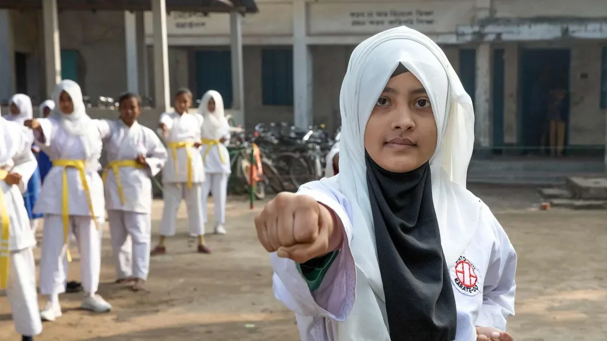 Rinky, 12, practicing karate at her school in Bangladesh