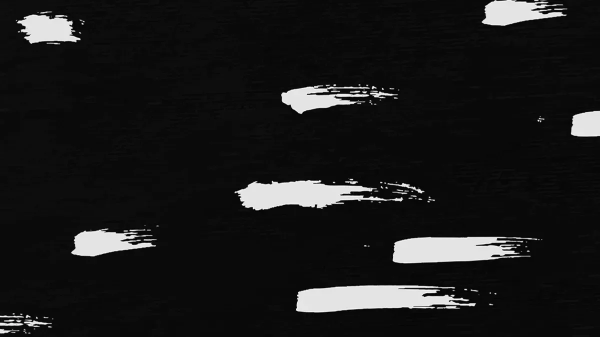 A black background with white paint smears