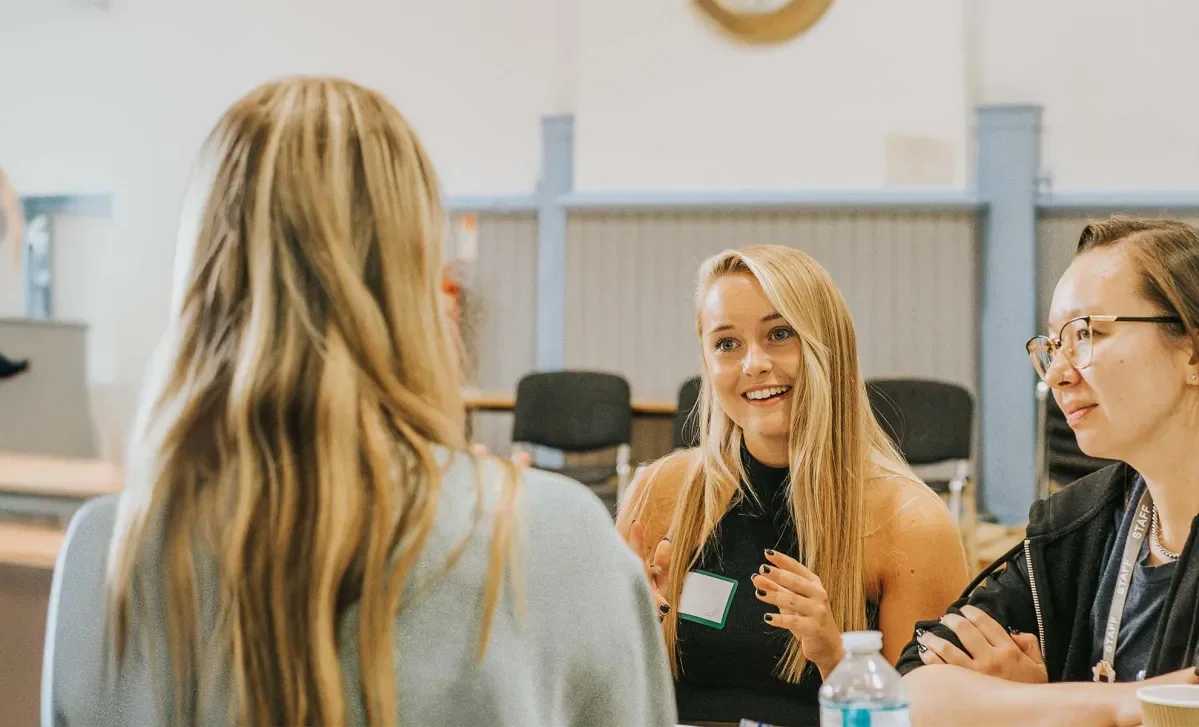 A group smile and talk during a workshop