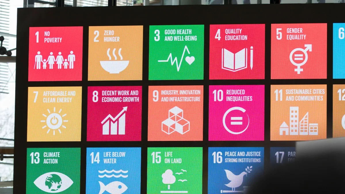 Large screen with graphics for all sustainable development goals displayed on it.