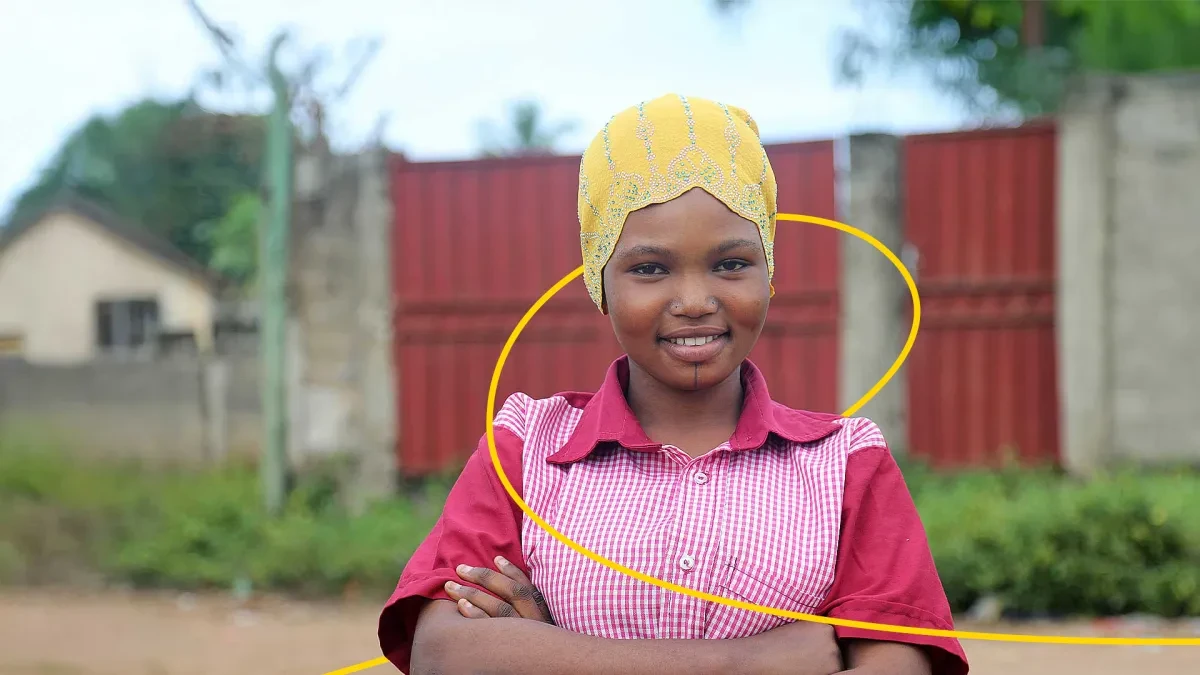 Roumana standing outside with arms crossed