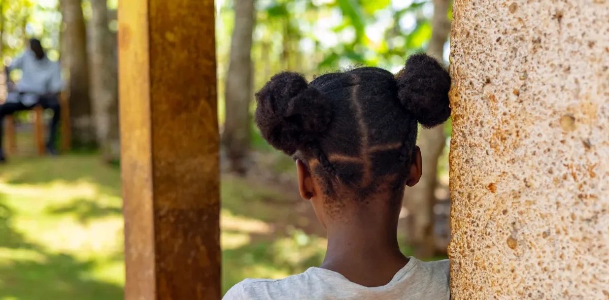 In 2021, escalating gang violence forced 31-year-old Marie* to flee Haiti’s capital, Port-au-Prince, with her two children, Junior*, 15, and Teta*, 13. Teta* (pictured) went on to experience sexual harassment and exploitation.