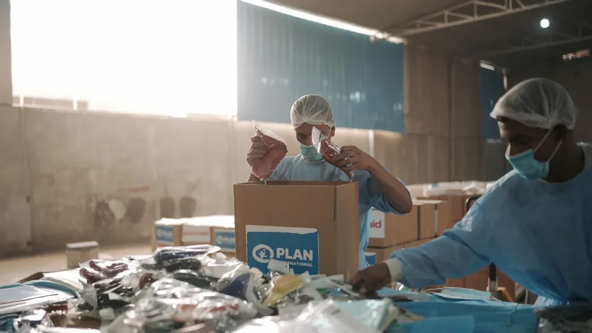 Members of Plan International Egypt prepare and pack dignity kits for girls and women in Gaza.