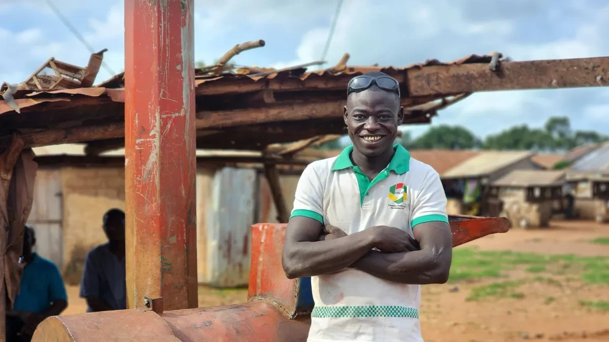 Kakarika smiling at camera with arms crossed