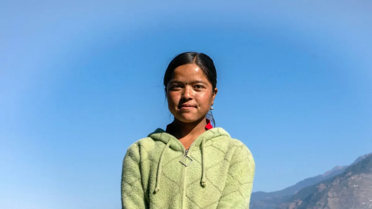 Headshot of Kokila with mountain range in background