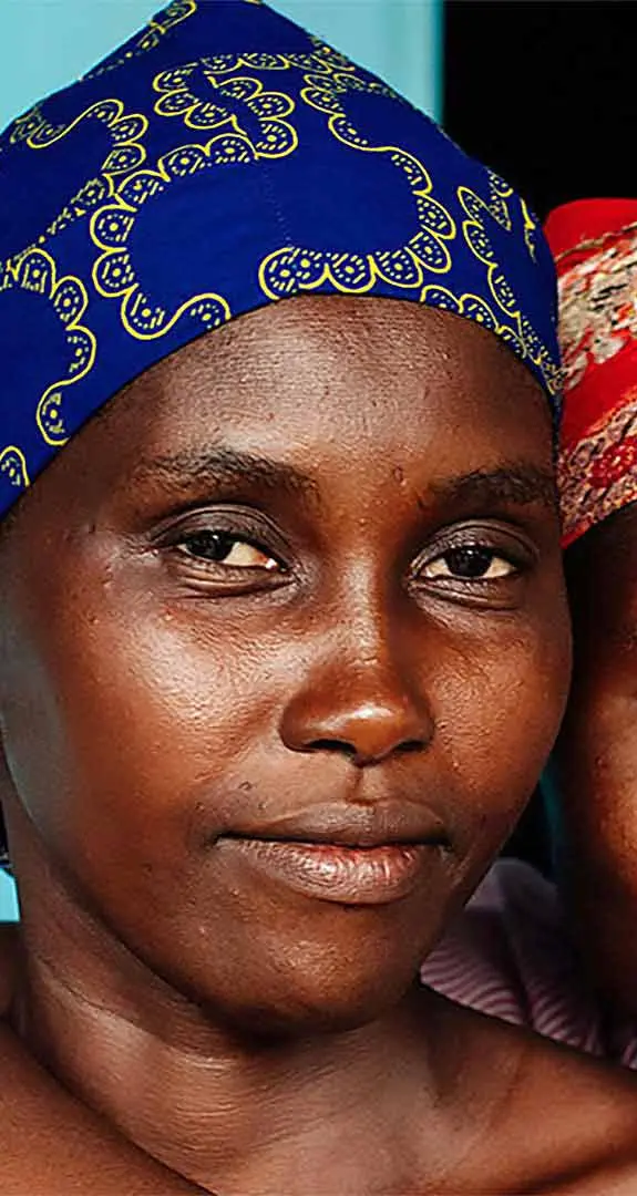 Two young women from Sierra Leone smiling at the camera