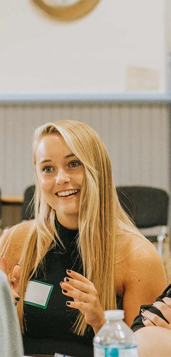 A group smile and talk during a workshop