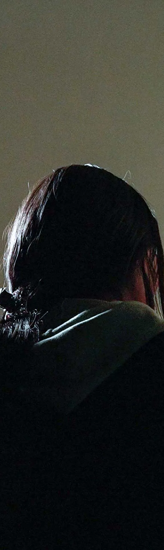 Flor* 20, who was forced into an abusive union stand in a doorway in her house in Peru.