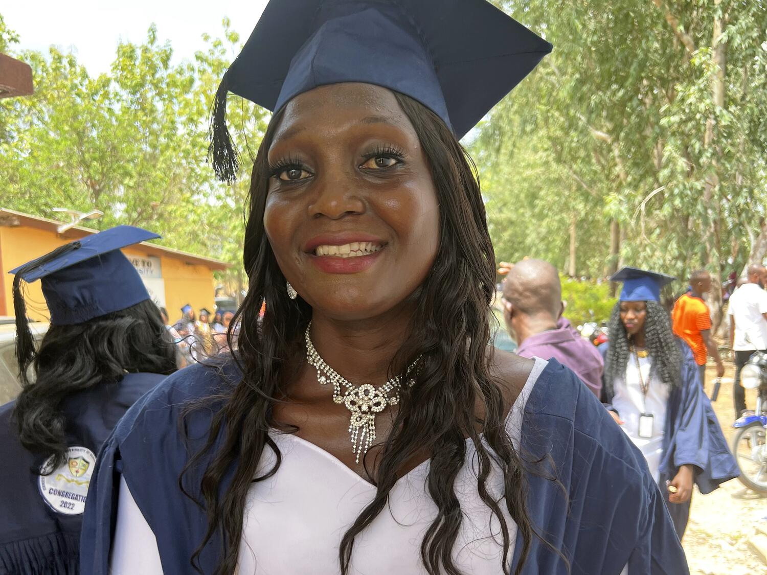 Jariatu in her gown and mortarboard during her graduation as a teacher