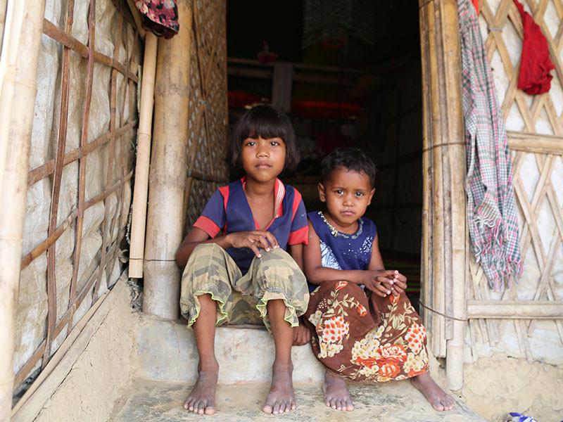 Sisters Kalima, 6, and Habiba, 4, were reunited with their family by Plan International after being caught up in a devastating fire that tore through a Rohingya refugee camp in Cox's Bazar, Bangladesh.