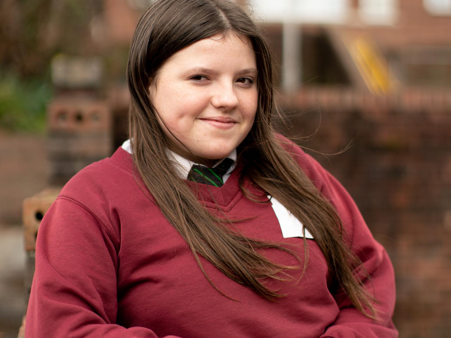 Kiera, 13, standing outside her school in Wales